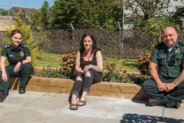 Kirsty Hext (26, centre) chats with Chloe Long (27, left) and Tim Ray (51, right) and thanks them for their care following her anaphylactic shock. Picture: Mike Cooter (090621)