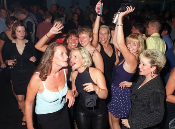 Revellers dancing the night away at Buddies 25+ nightclub at The Pyramids Centre, Southsea.