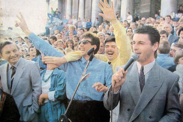 Paul Mariner, centre, celebrates Pompey promotion at the end of the 1986-87 season at Guildhall Square with team-mates Mick Quinn and Mick Kennedy.