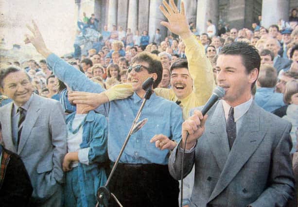 Paul Mariner, centre, celebrates Pompey promotion at the end of the 1986-87 season at Guildhall Square with team-mates Mick Quinn and Mick Kennedy.