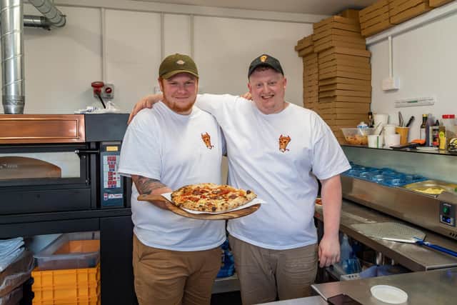 Two of the directors of Pizzilia at work in the kitchen. Pictured: Daniel Milsom (35) and Paul Cleall (29). Picture: Mike Cooter (280523)