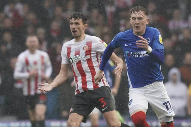 Sunderland defender Tom Flanagan watches Pompey's Ronan Curtis go past him during Saturday's game at Fratton Park.  Picture: Jason Brown