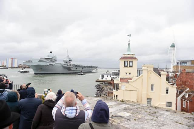 HMS Queen Elizabeth leaving Portsmouth drew crowds across Old Portsmouth. 
Picture: Sarah Standing (101122-5836)