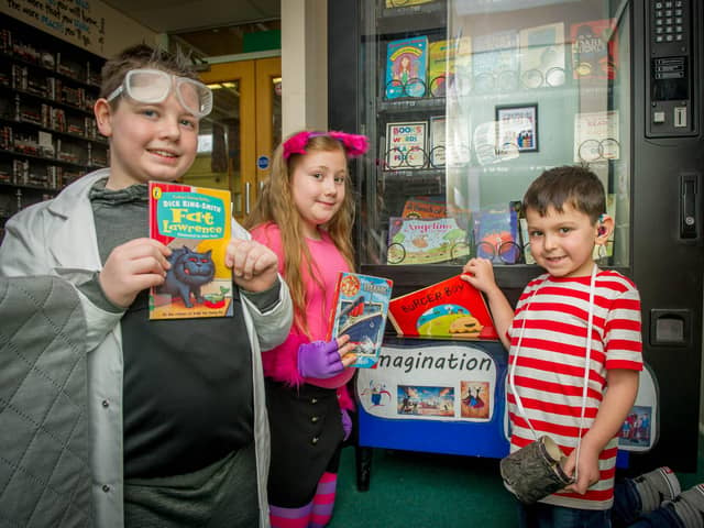 Georgie Palmer, 10, Bethany Strutt, 9, and Zachary Howard, 6, were the first three students to purchase books after being nominated for a special gold coin.
Picture: Habibur Rahman