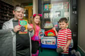 Georgie Palmer, 10, Bethany Strutt, 9, and Zachary Howard, 6, were the first three students to purchase books after being nominated for a special gold coin.
Picture: Habibur Rahman