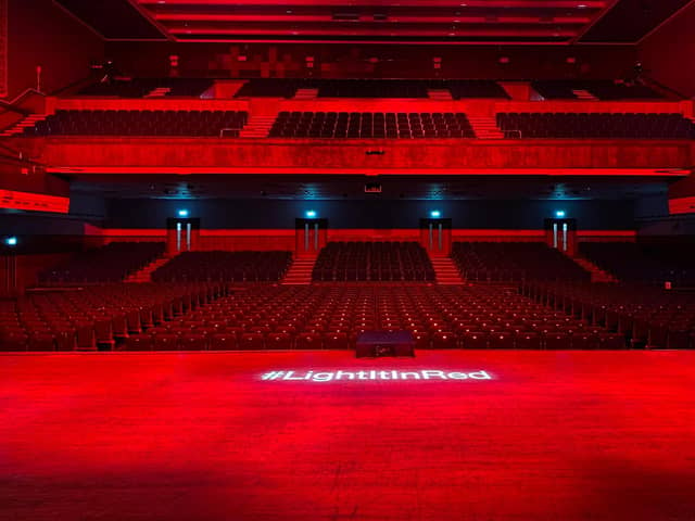 The main auditorium of Portsmouth Guildhall lit up on September 30, 2020, for #lightitinred