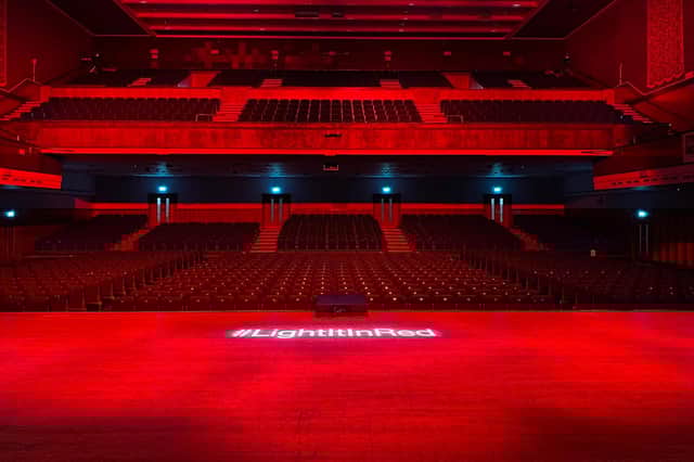 The main auditorium of Portsmouth Guildhall lit up on September 30, 2020, for #lightitinred