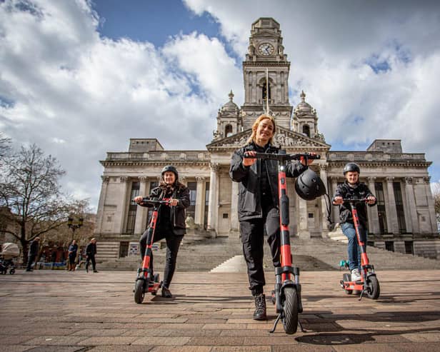 Pictured: Voi scooter team, Jon Hamer, Maria Sassetti and Nikolina Kotur on the e-scooters at Portsmouth Guildhall walk on 15 March 2021.
Picture: Habibur Rahman