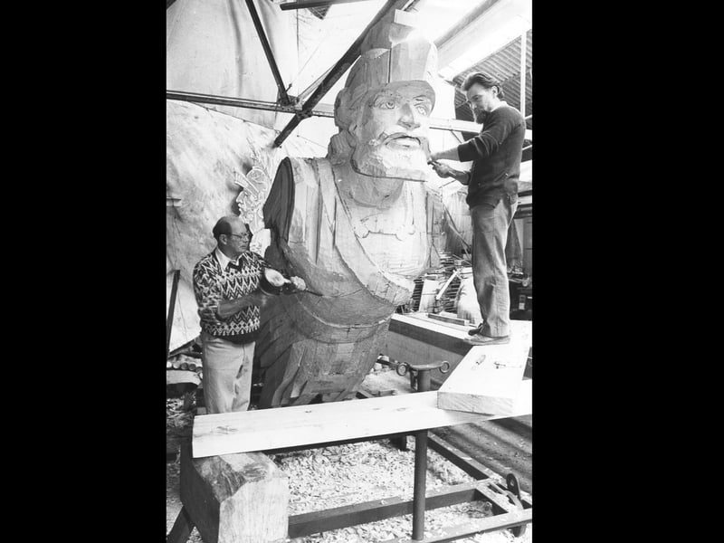 Jack Whitehead (left) and Norman Gaches sculpt Warrior's figurehead in October 1987. The News PP5408