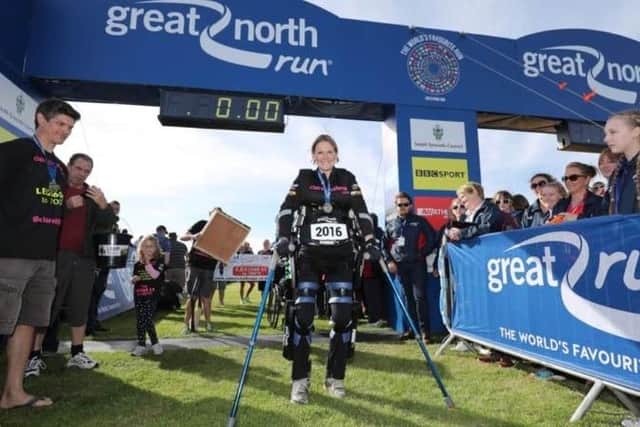 Claire Lomas completing the Great North Run in a robotic suit. She also completed the Great South Run