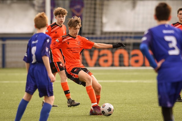 Action from the Portsmouth Youth League Stuart Madigan Cup final between Baffins Milton Rovers Vipers U14s (all blue kit) and AFC Portchester Vikings U14s (orange and black kit). Picture: Keith Woodland (190321-975)