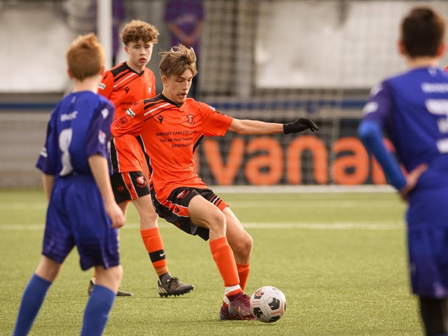 Action from the Portsmouth Youth League Stuart Madigan Cup final between Baffins Milton Rovers Vipers U14s (all blue kit) and AFC Portchester Vikings U14s (orange and black kit). Picture: Keith Woodland (190321-975)