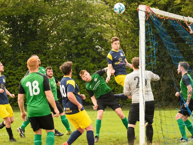 Action from Saturn Royale's 1-0 win over Pelham Arms (blue and yellow kit) in the second Adelaide Cup semi-final. Picture: Keith Woodland (300421-397)