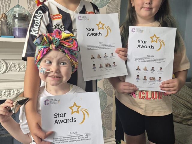 Dulcie with her Star Award and certificates that her brother, Billy and sister, Norah, also received.