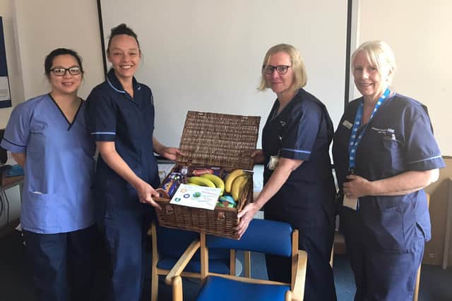 Workers at QA Hospital in Cosham with one of the school hampers. Picture: Newtown C of E Primary School