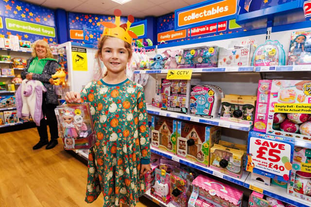 Rosie was happy with her new toy at the Toys R Us grand opening in Havant.