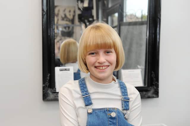 Rebekah Patis (10) from Waterlooville, had her haircut at Jenuine Styles in Waterlooville on Friday, October 23, and is donating her hair to the Little Princess Trust.Picture: Sarah Standing (231020-6596)
