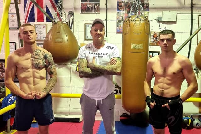 Team Wiseman Boxing head coach Daron Wiseman, centre, with Charlie Martin, left, and Declan Conlon
