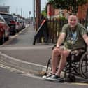 Steven Kingett at Moorings Way near the drain that he got stuck in. Picture: Habibur Rahman