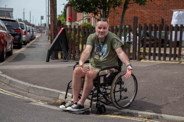 Steven Kingett at Moorings Way near the drain that he got stuck in. Picture: Habibur Rahman