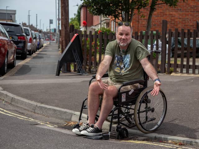 Steven Kingett at Moorings Way near the drain that he got stuck in. Picture: Habibur Rahman