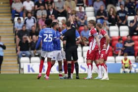 Joe Rafferty is shown a red card by referee Simon Mather against Stevenage. Picture: Jason Brown/ProSportsImages