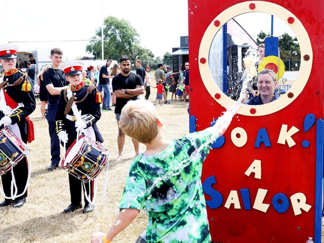 The Commanding Officer, HMS Sultan, Capt Jo Deakin OBE gets wet in the ‘Soak A Sailor’. Picture by PO Phot Pepe Hogan