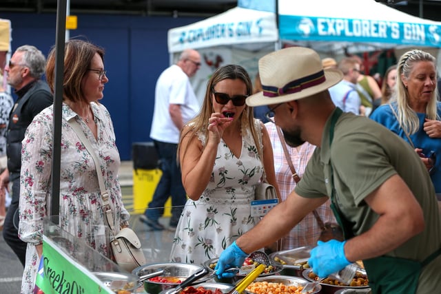 Natalia Yakovleva, second left, chooses mixed olives and peppers. Southsea Food Festival on Palmerston, Clarendon and Osborne Roads
Picture: Chris Moorhouse (200724-28)