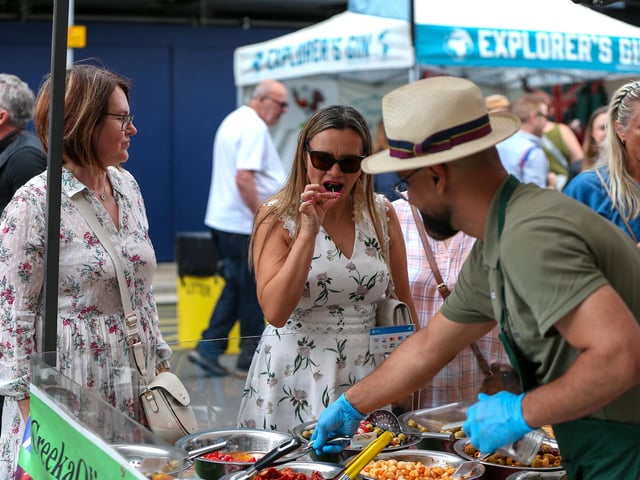 Natalia Yakovleva, second left,  chooses mixed olives and peppers. Southsea Food Festival on Palmerston, Clarendon and Osborne RoadsPicture: Chris  Moorhouse (200724-28)