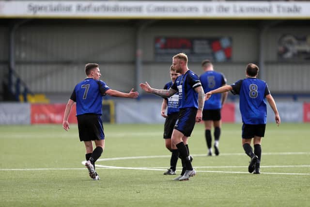 Jake Hughes, left, is congratulated after his stunning long-range strike against Paulsgrove. Picture: Chris Moorhouse
