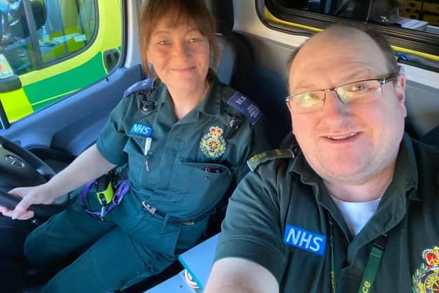 Stephen Dawson, right, with a colleague from South Central Ambulance Service. Picture: Supplied