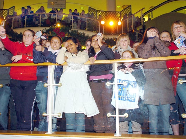 Flashback to 2005: The crowd to watch Kemal from the TV reality show Big Brother in the food court of The Cascades shopping centre switch on the Christmas lights. Unfortunately, the lights came on prematurely after a practise countdown initiated by Kemal went wrong.