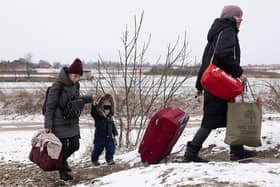 KRAKOVETS, UKRAINE - MARCH 09: Refugees fleeing conflict make their way to the Krakovets border crossing with Poland on March 09, 2022 in Krakovets, Ukraine. (Photo by Dan Kitwood/Getty Images) (Photo by Dan Kitwood/Getty Images)