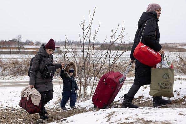 KRAKOVETS, UKRAINE - MARCH 09: Refugees fleeing conflict make their way to the Krakovets border crossing with Poland on March 09, 2022 in Krakovets, Ukraine. (Photo by Dan Kitwood/Getty Images) (Photo by Dan Kitwood/Getty Images)