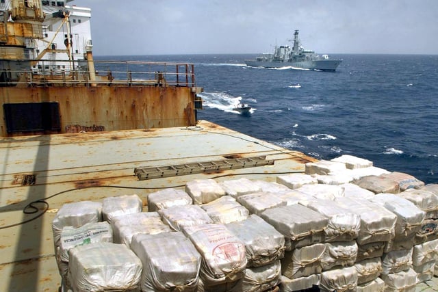 Undated Royal Navy handout of a massive shipment of cocaine, worth £250 million, which was found by a navy frigate aboard a merchant ship in the Caribbean, it was revealed, Thursday June 26, 2003. HMS Iron Duke (background) stopped a Panamanian-registered merchant ship following a tip-off from Customs officers in the UK. The 3.3 tonnes of cocaine was believed to be destined for Europe and was hidden behind specially-made, false steel bulkhead plates on the 11,500-tonne ship Yalta which was stopped 400 miles south-west of St Lucia. See PA story CRIME Drugs. PA Photo: Jack Russell/Royal Navy/handout