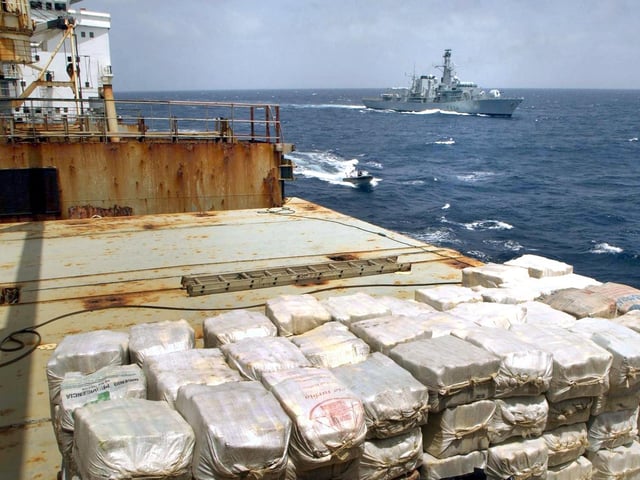 Undated Royal Navy handout of a massive shipment of cocaine, worth £250 million, which was found by a navy frigate aboard a merchant ship in the Caribbean, it was revealed, Thursday June 26, 2003. HMS Iron Duke (background) stopped a Panamanian-registered merchant ship following a tip-off from Customs officers in the UK. The 3.3 tonnes of cocaine was believed to be destined for Europe and was hidden behind specially-made, false steel bulkhead plates on the 11,500-tonne ship Yalta which was stopped 400 miles south-west of St Lucia. See PA story CRIME Drugs. PA Photo: Jack Russell/Royal Navy/handout