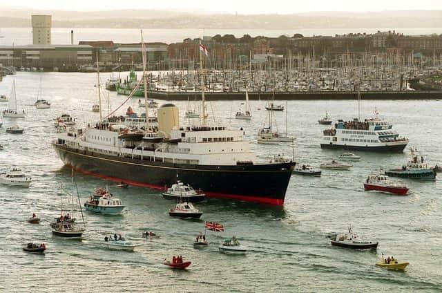 The Royal Yacht Britannia sailing into Portsmouth for the last time before being decommissioned in 1997. Rebecca Naden/PA Wire