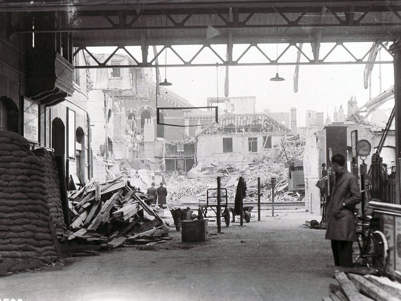 Although bombs caused destruction all around it, Portsmouth & Southsea railway station suffered comparatively little damage, apart from broken glass. This picture was taken in the station looking out to Station Street