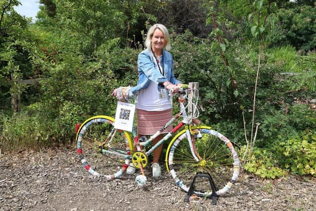 An image of Hampshire County Council's Executive Member for Climate Change and Sustainability, Councillor Jan Warwick with one of the Climate Unity project artworks.
Picture credit: Mark Powell