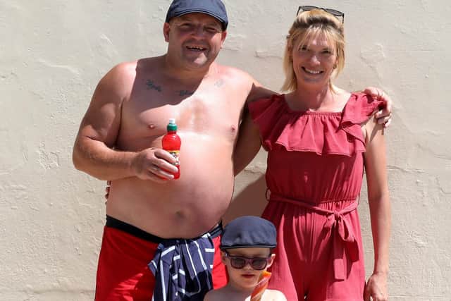 Hot weather in Southsea.Pictured is Day Gary Byrne, 44, Son Paddy, 3, and Mum Casey Otterway, 34.Picture: Sam Stephenson