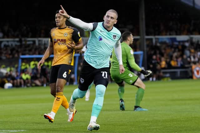 Ronan Curtis celebrates one of his two goal at Newport County tonight.
