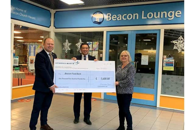 Caption: Emlyn Taylor, Alan Mak MP and Liz Ascua present £1,400 cheque to Beacon Food Bank 
Credit: Lockheed Martin UK