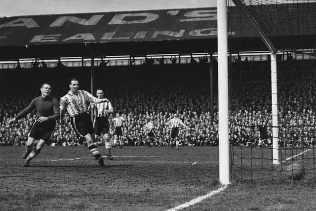 England striker Tommy Lawton (second left) caused a sensational when he left Chelsea to join Third Division Notts County in 1947. Photo by Central Press/Getty Images.