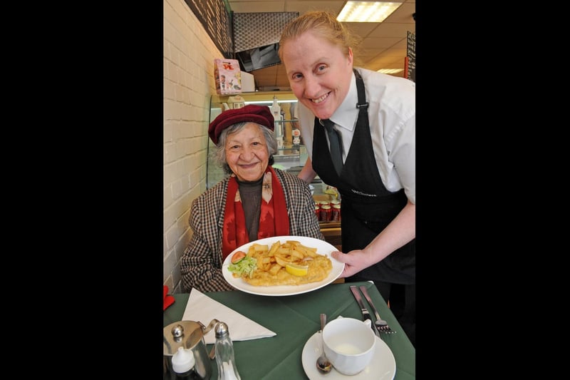2011. Whistlers Fish and Chip shop in West Fareham. (left to right) Mrs Francesina Henderson (80) is served her regular cod and chips by Sandra Bishop (42) . Picture: Malcolm Wells 110911-5619