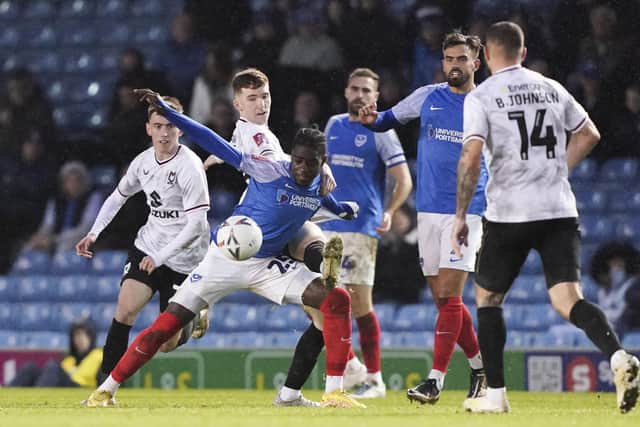 Jay Mingi battles for possession during his outstanding man-of-the-match performance in Pompey's 3-2 FA Cup win over MK Dons. Picture: Jason Brown/ProSportsImages