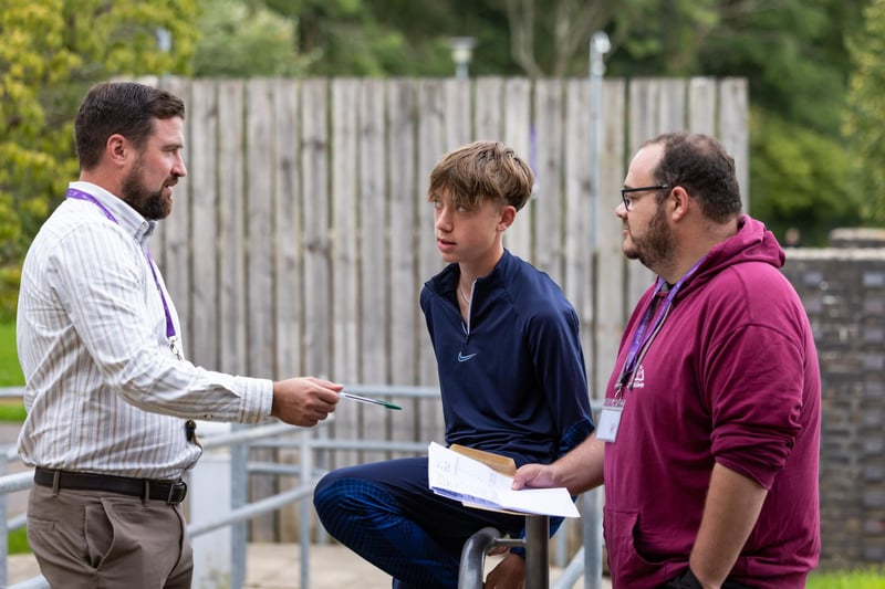 Josh Lumsden (16) chats with his tutors at Havant Academy about his plans after receiving his GCSE results. Picture: Mike Cooter (240823)