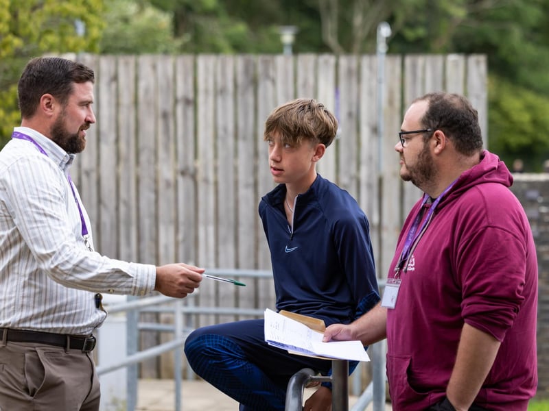 Josh Lumsden (16) chats with his tutors at Havant Academy about his plans after receiving his GCSE results. Picture: Mike Cooter (240823)