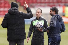 David Artell and Danny Cowley speak to ref Martin Coy on Saturday.