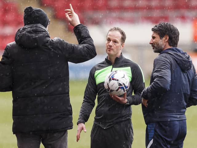 David Artell and Danny Cowley speak to ref Martin Coy on Saturday.
