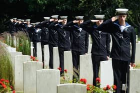 VS sailors saluting the headstones at Haslar cemetery
